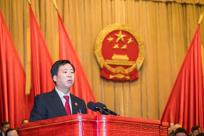 王爱新院长在区二届人大三次会议上作法院工...